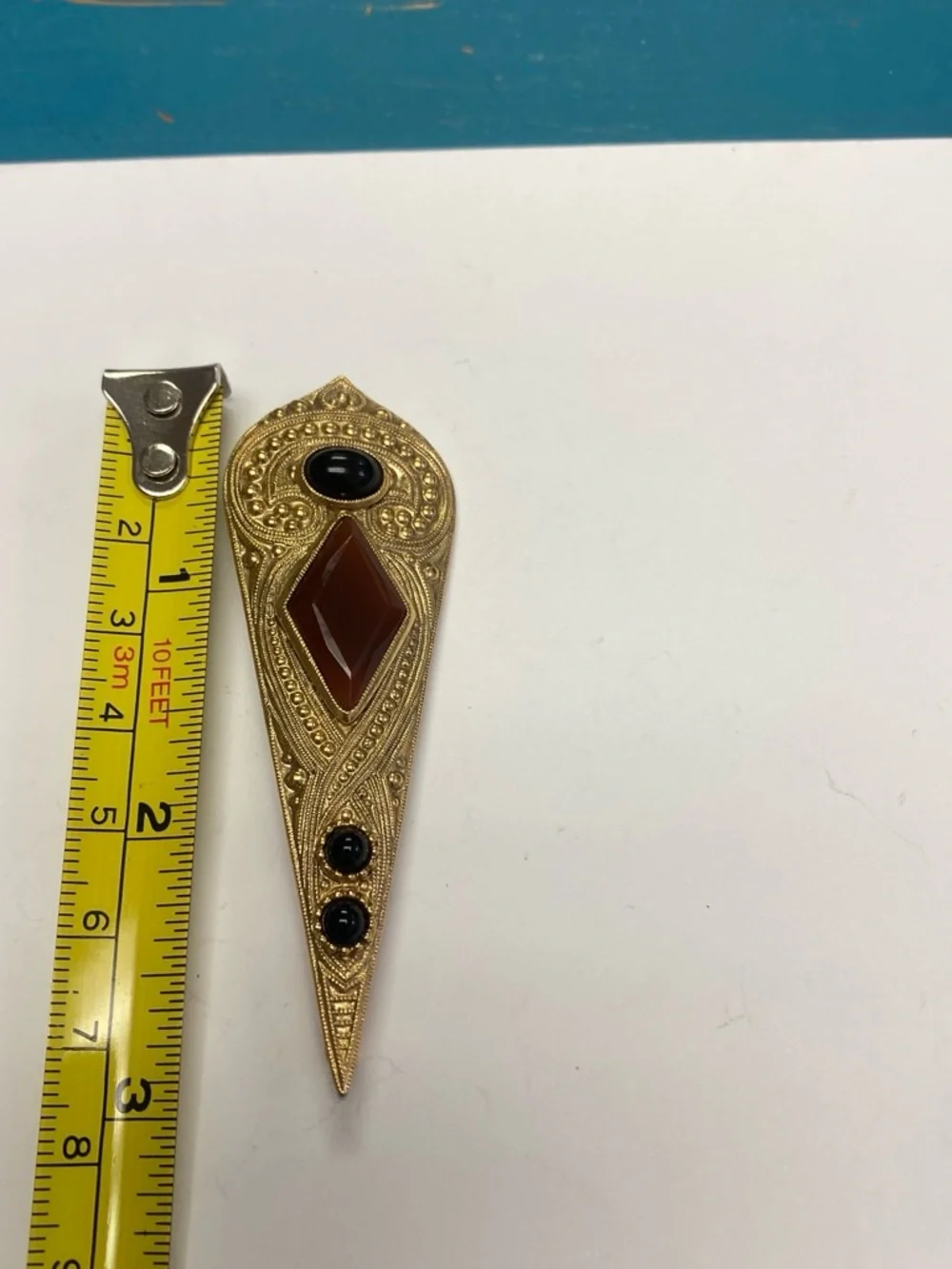 Gold-Tone Filigree Pin with Brown and Black Stones